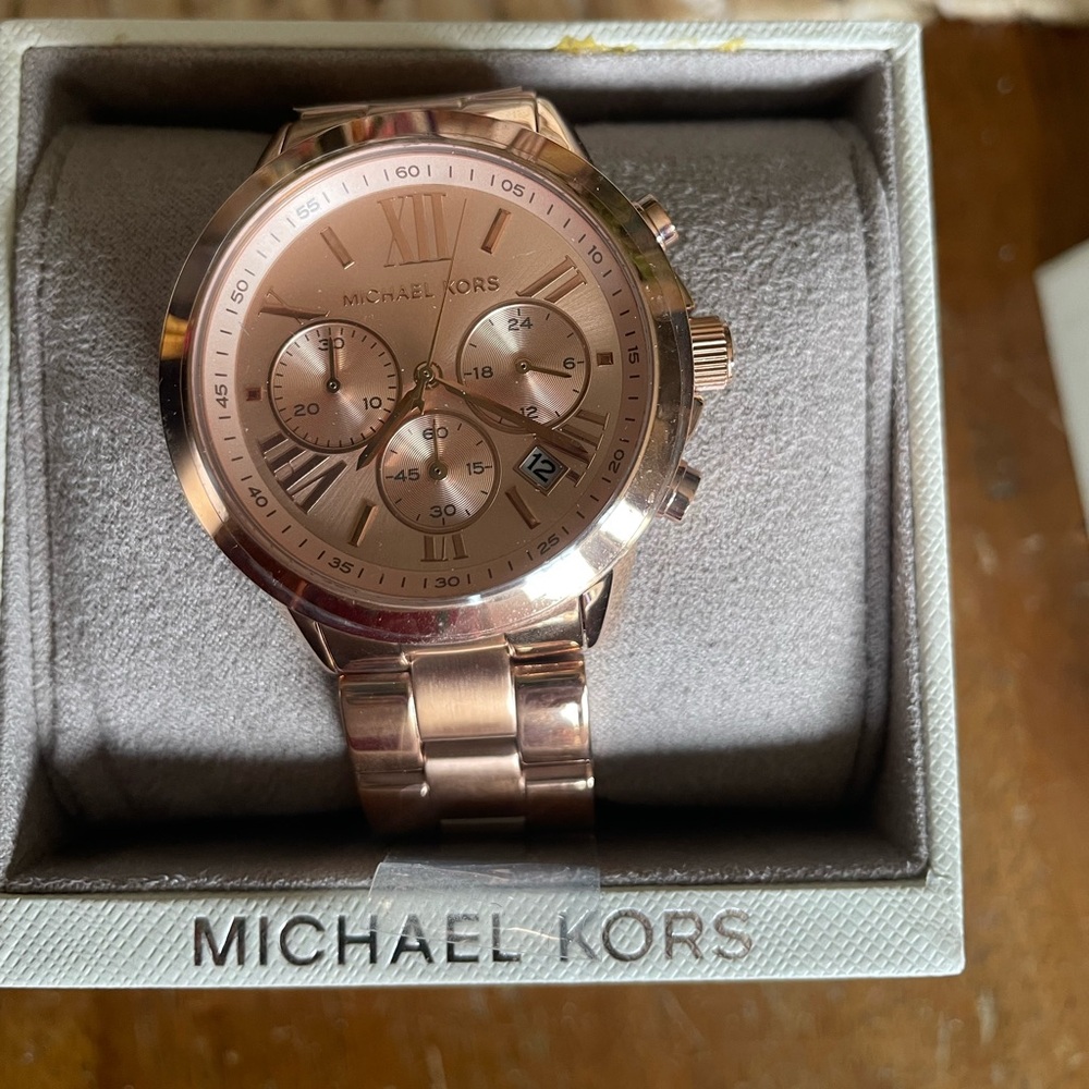 Michael Kohrs men’s rose gold watch.